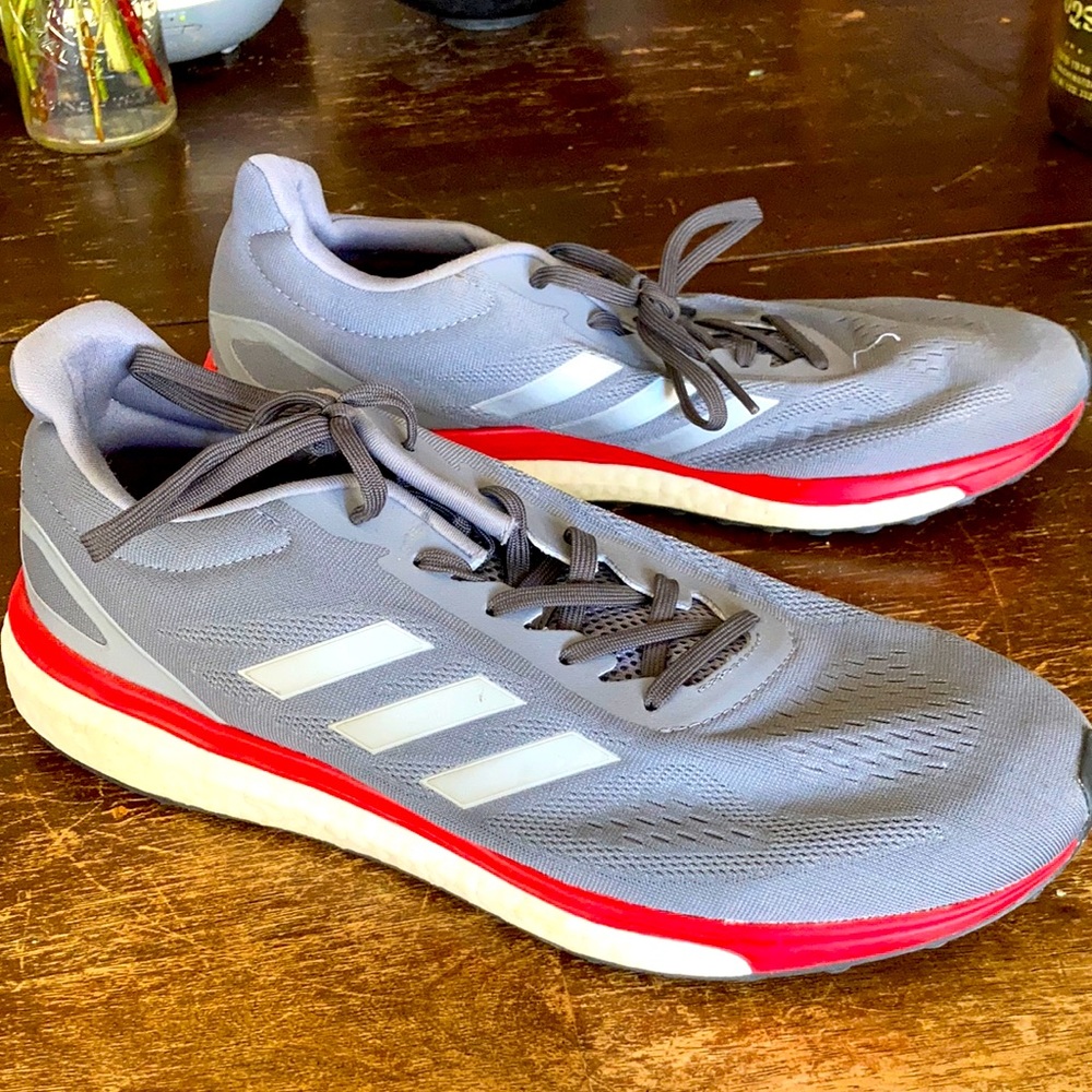 Adidas gray/silver/red running shoes.